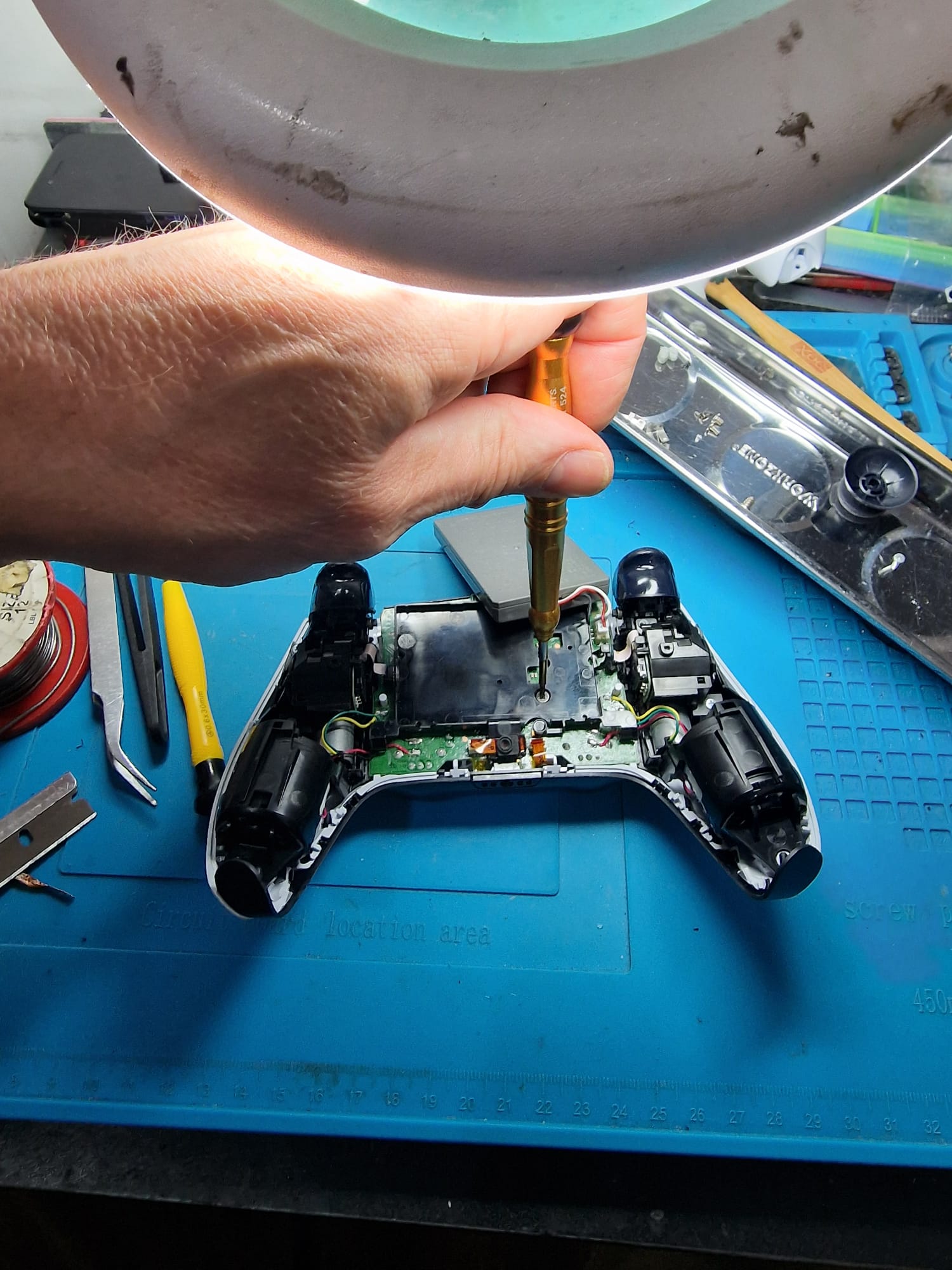 Gatley Repairs technician repairing a laptop in the workshop